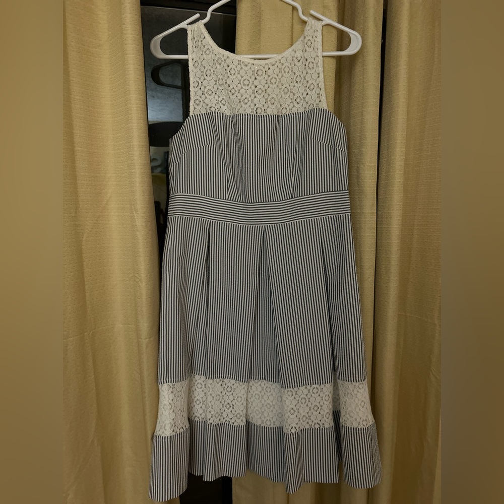 Blue and white seersucker dress with lace detailing.